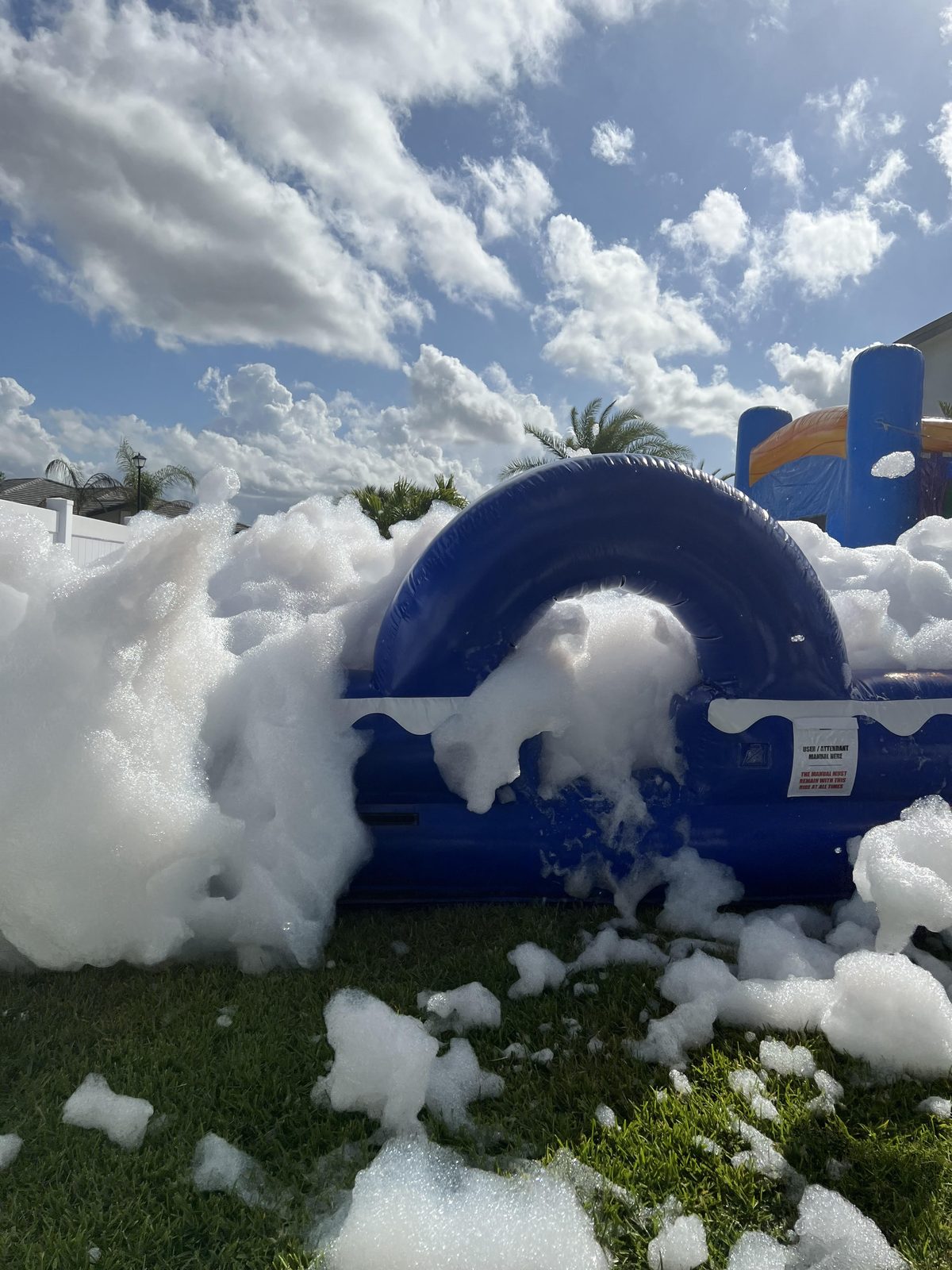 Inflatable foam pit overflowing with mountains of party foam